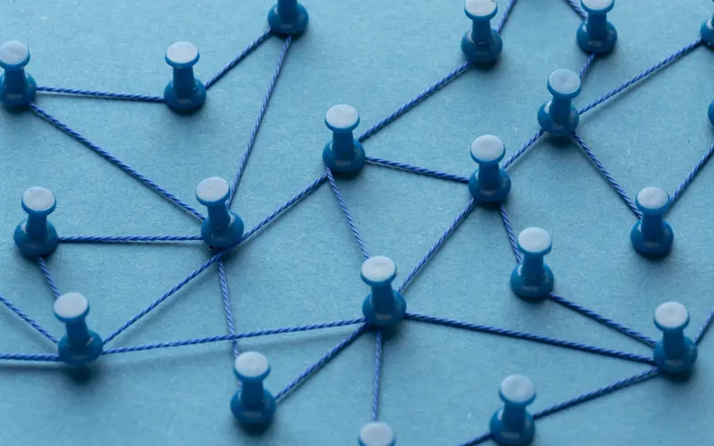 Series of pins connected by looping wire to mirror a connected system