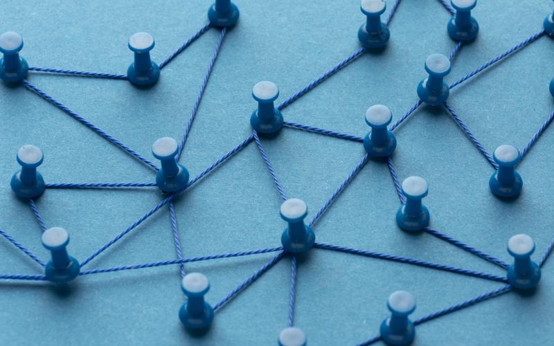 Series of pins connected by looping wire to mirror a connected system