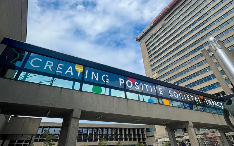 A building at Erasmus University, Rotterdam. Vinyl text on windows reads 