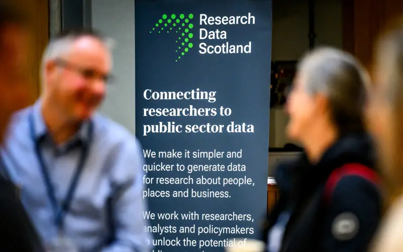 Photo of a banner with the Research Data Scotland logo and the text 