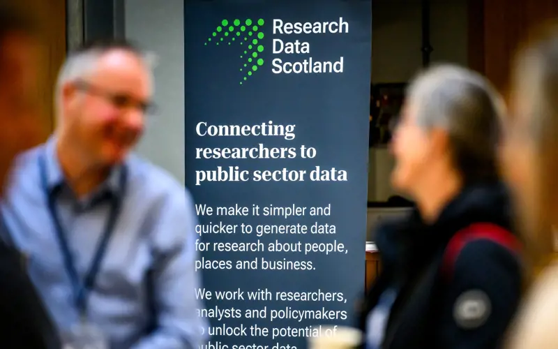 Photo of a banner with the Research Data Scotland logo and the text 