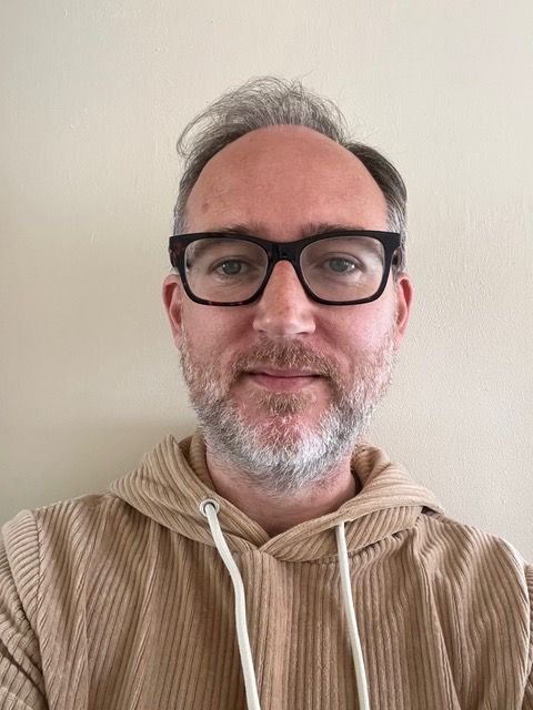 Headshot of Milo McLaughlin