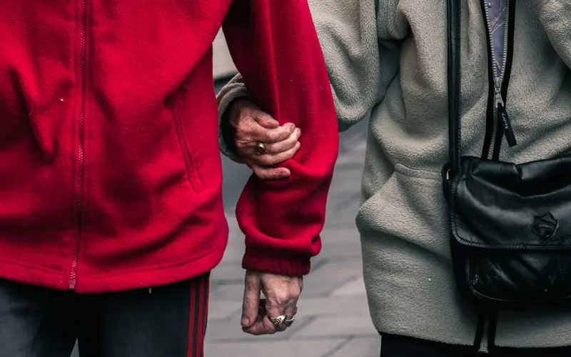 One person holds onto another