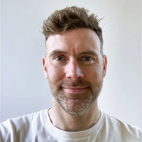 Headshot of Adam Coulson