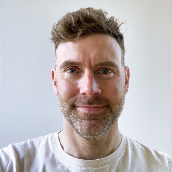 Headshot of Adam Coulson