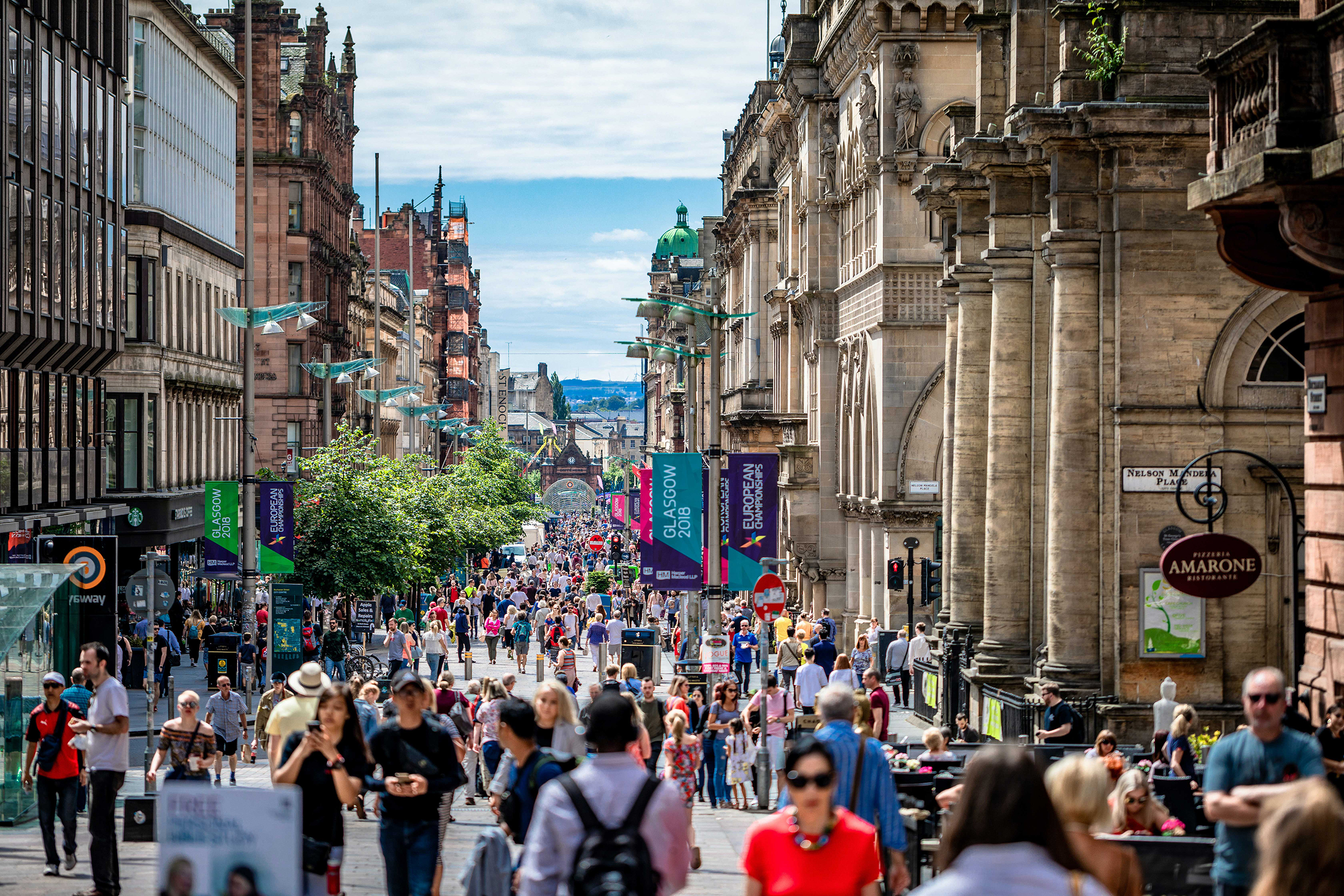 Crowds on Buchanan St in Glasgow on a sunny day