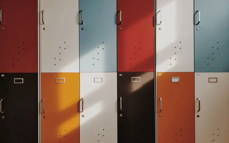 Two rows of multi-coloured lockers.