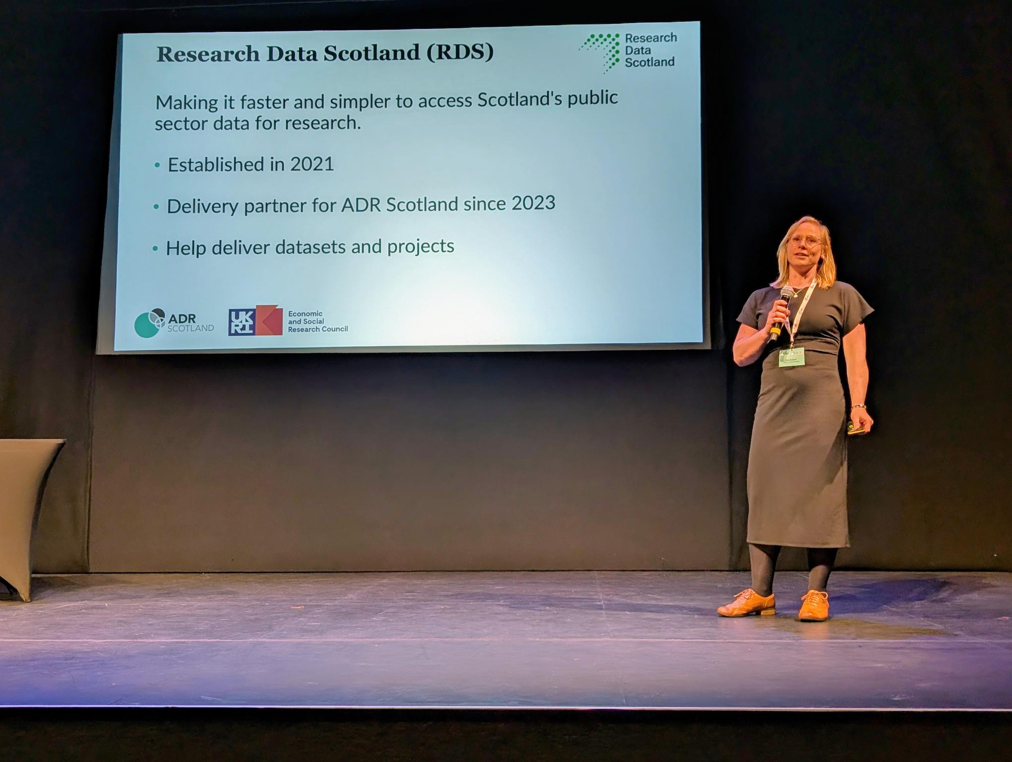 Sian Robson on stage presenting at ADR UK Conference 2025
