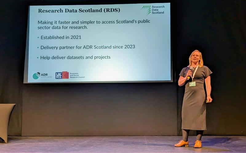 Sian Robson on stage presenting at ADR UK Conference 2025