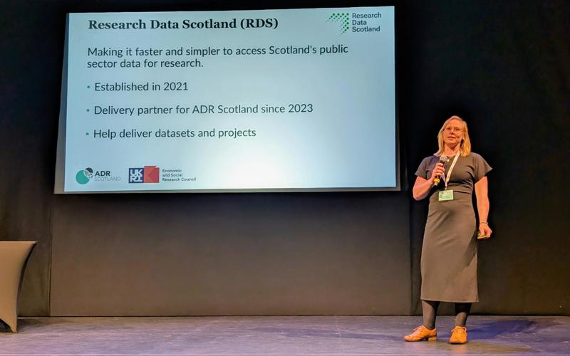 Sian Robson on stage presenting at ADR UK Conference 2025